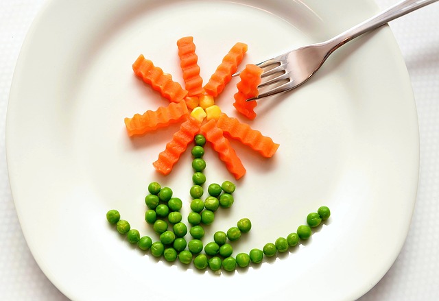 Plate of healthy food arranged in a flower to promote healthy eating