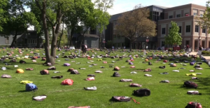 Image of 1,100 backpacks, the number of college students that die each year by suicide.