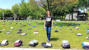 Image of 1,100 backpacks, the number of college students that die each year by suicide.